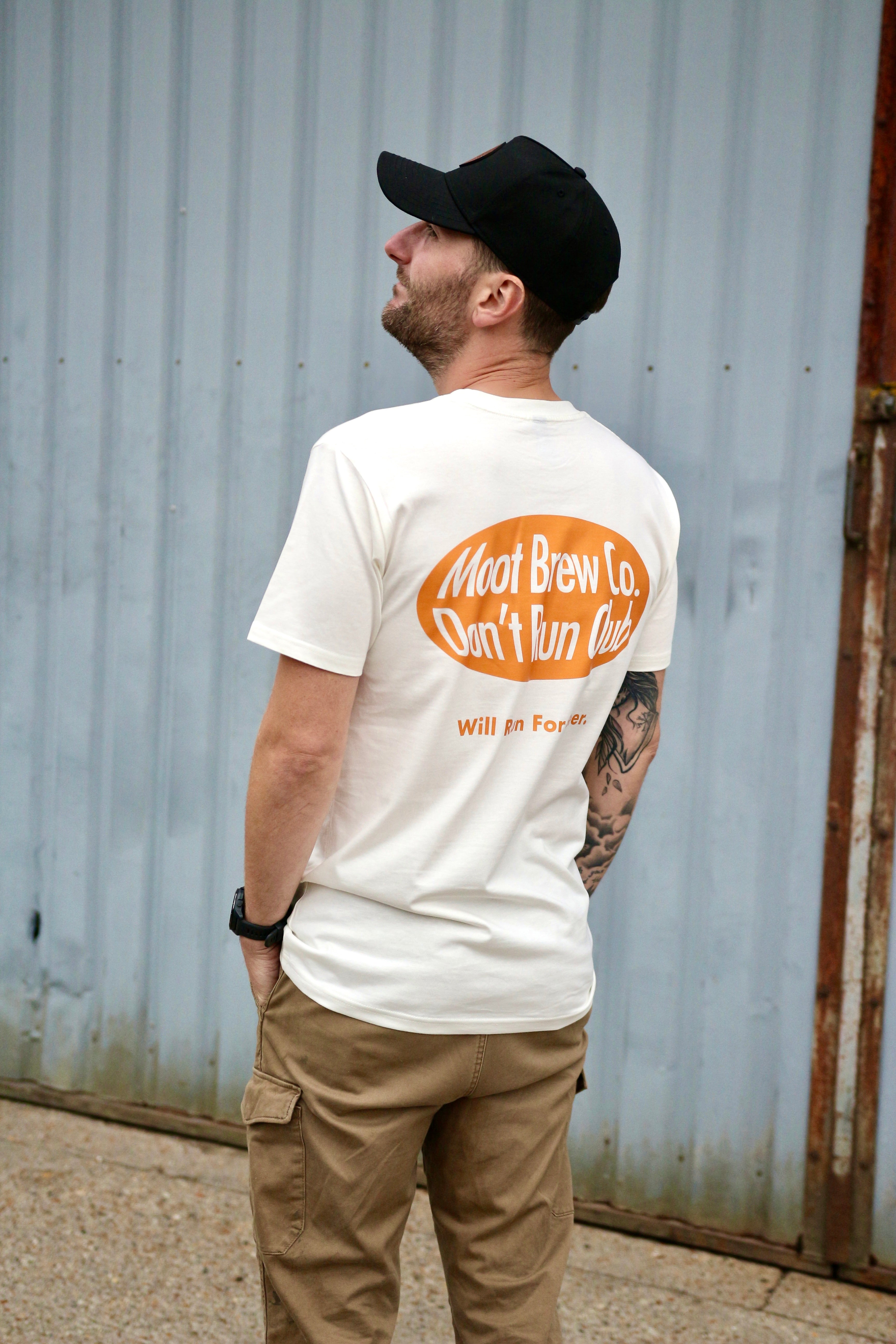 Person wearing Moot Brew Co Don’t Run Club tee at brewery