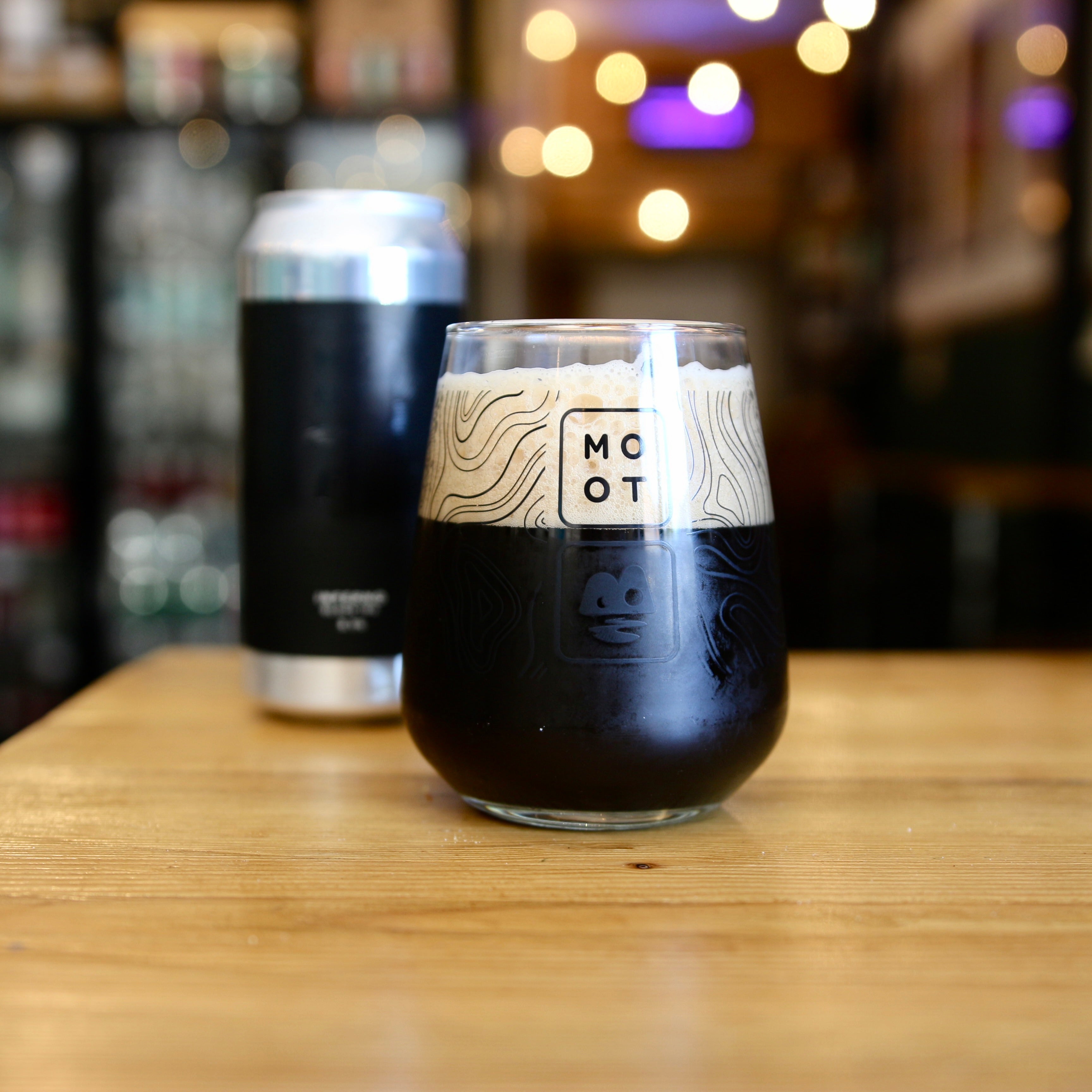 Dark Black IPA beer poured into glass with tan foam and rich aroma