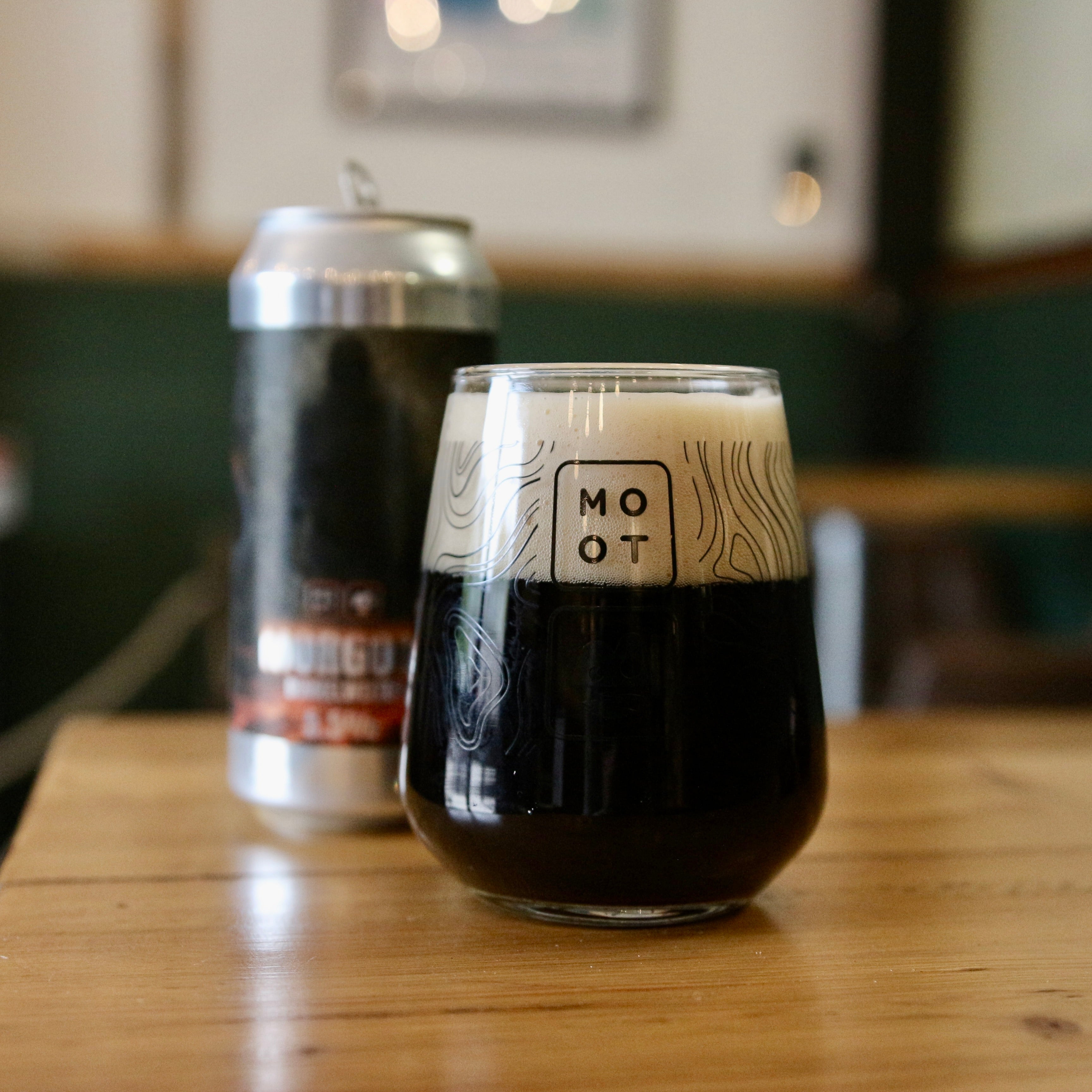 German Dunkelweizen beer poured into glass with caramel color and foamy head
