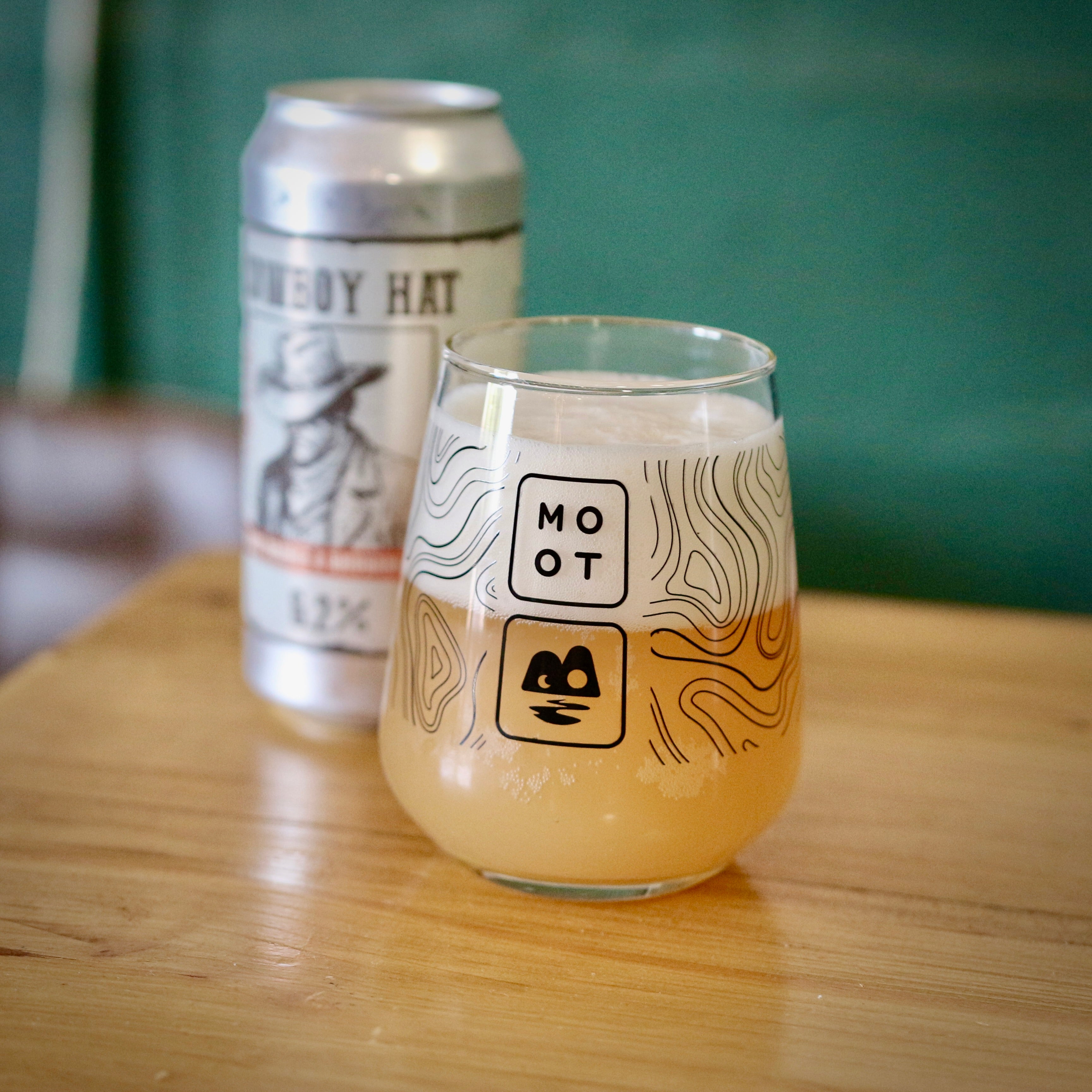 Bright orange sour beer poured into glass with foamy head and citrus aroma