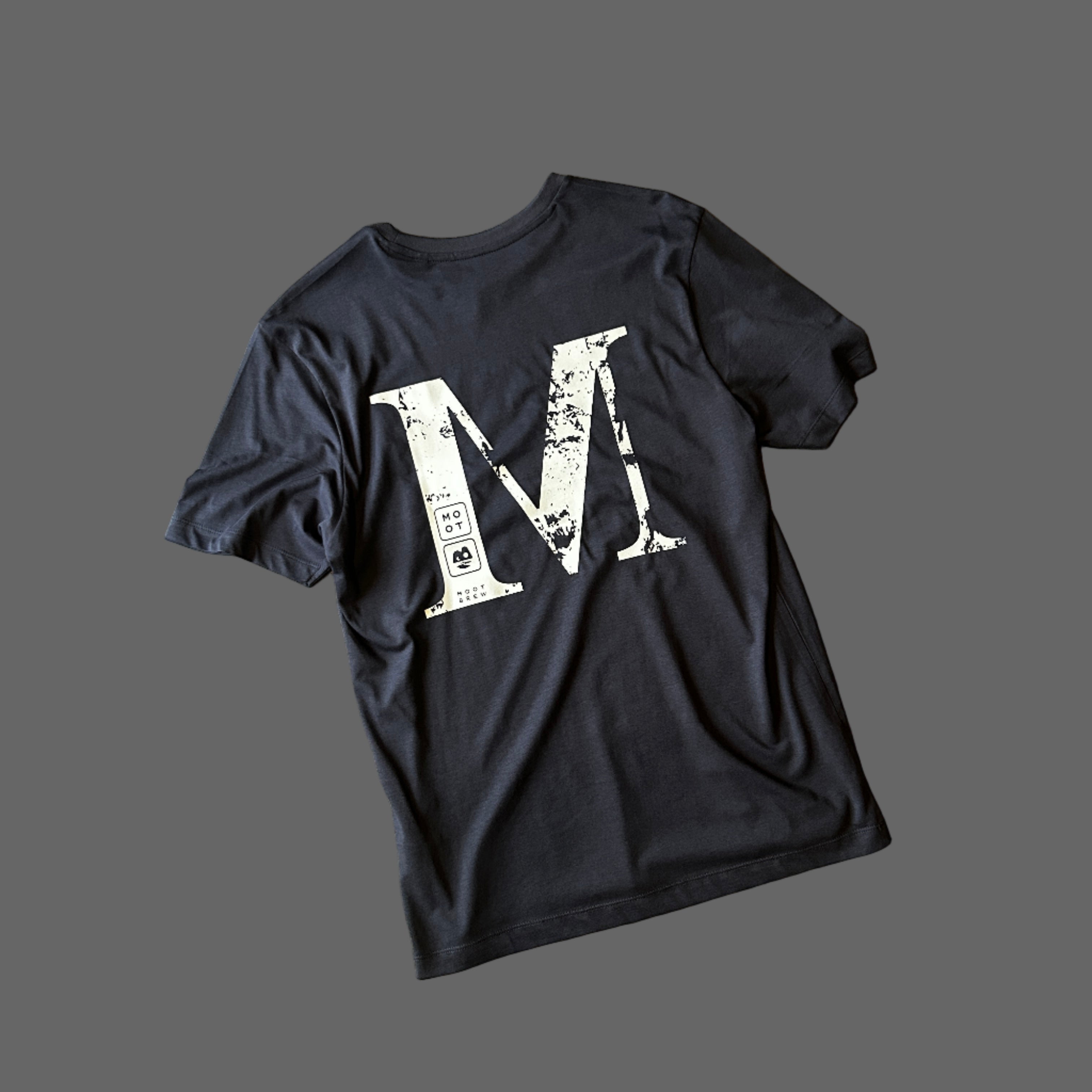 BACKWARDS M TEE