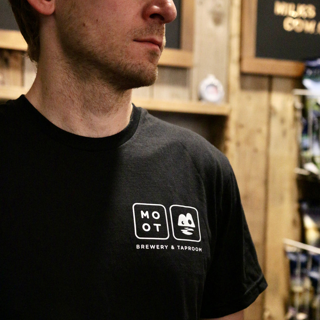 Person wearing Moot Brewery & Taproom logo tee at taproom
