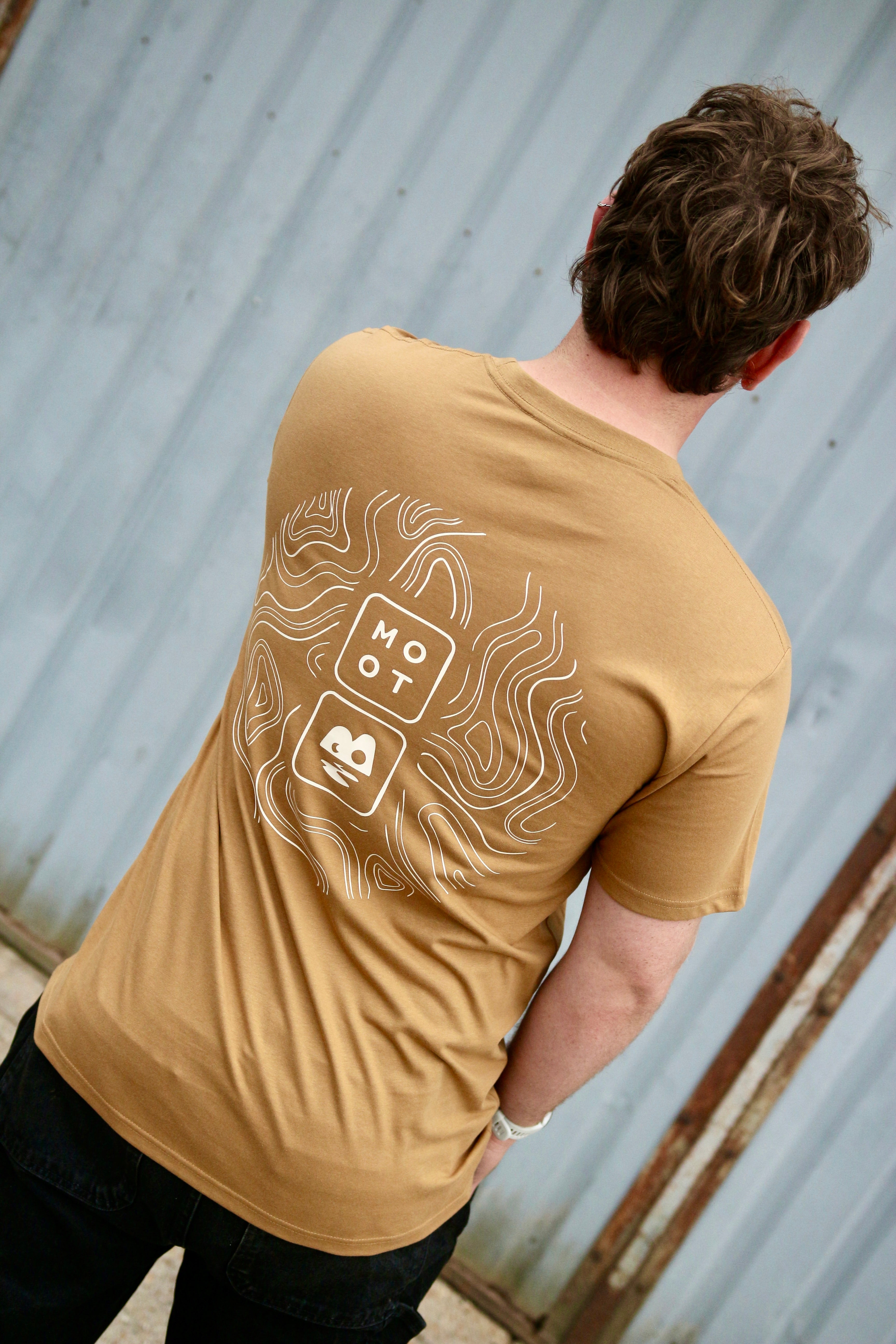 Person wearing Moot Brewery & Taproom logo tee at taproom