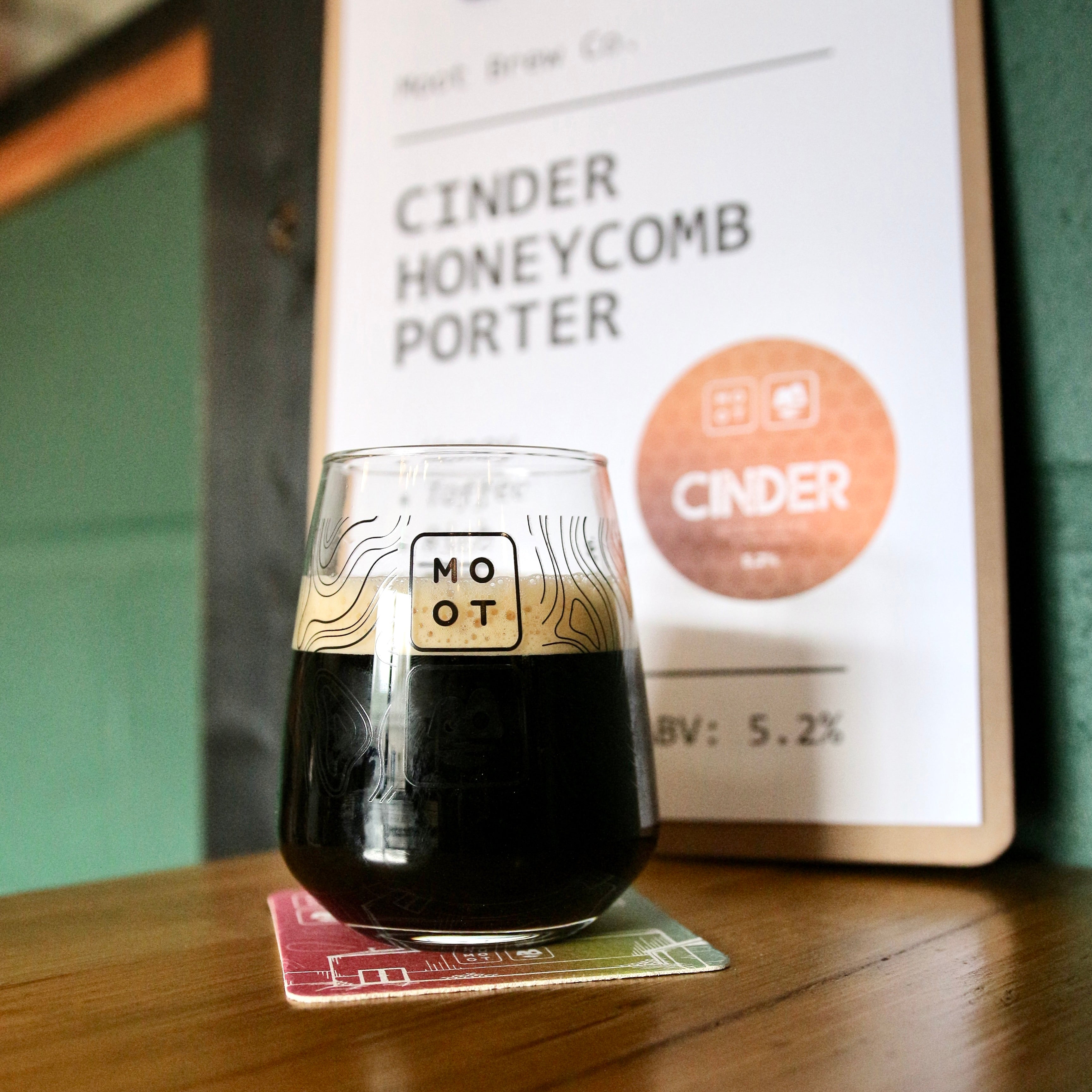 Dark porter poured into glass with tan foam and rich caramel aroma