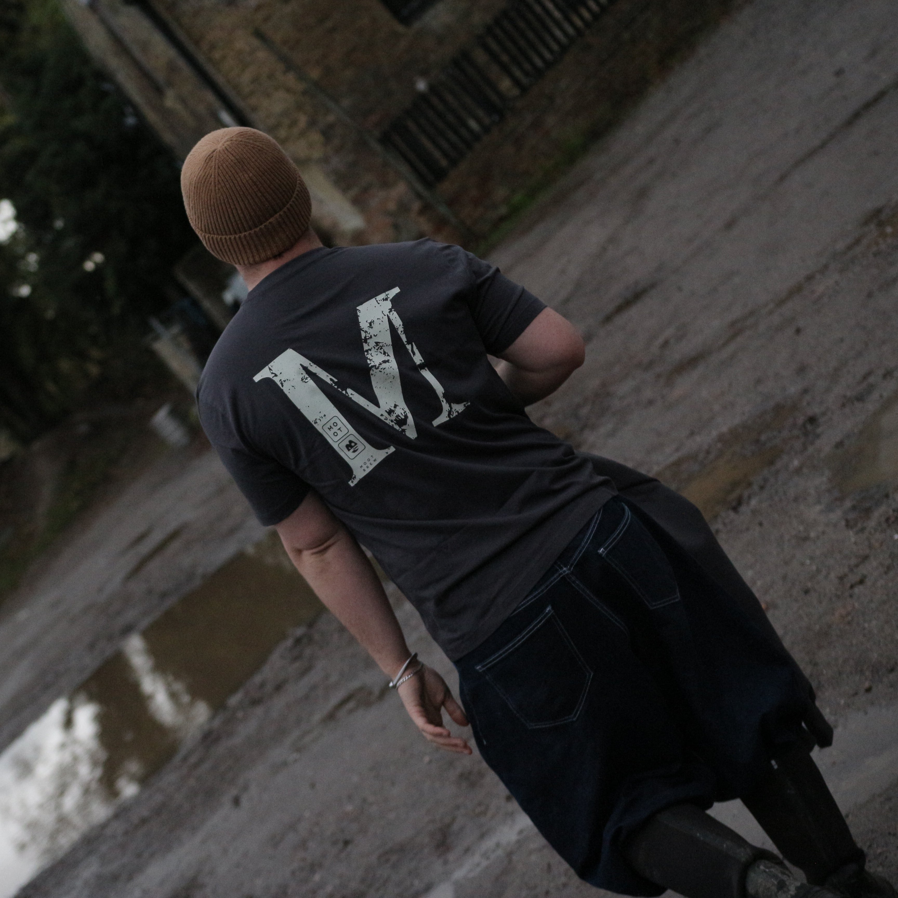 BACKWARDS M TEE
