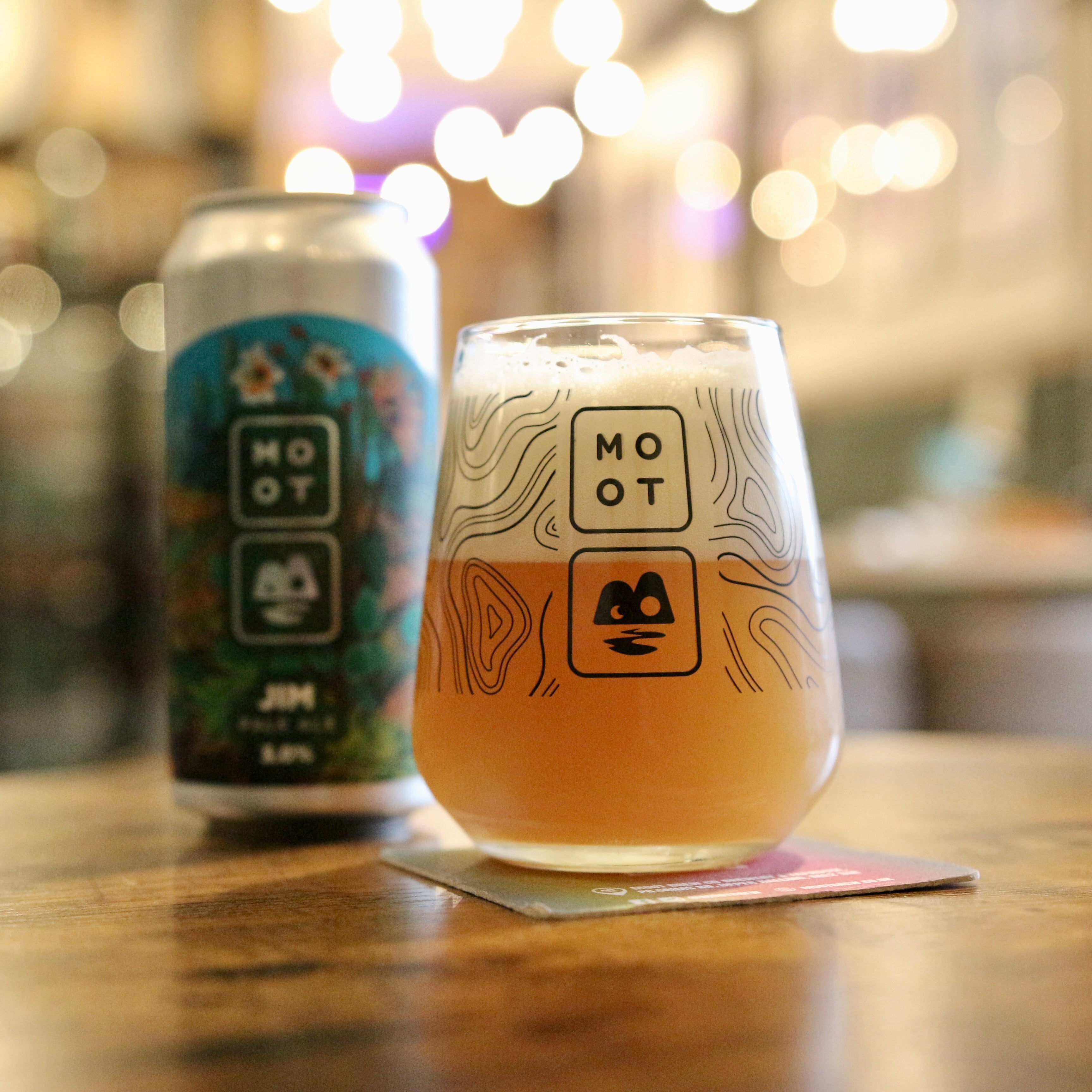 Pale ale poured into glass with soft haze and fruity hop aroma