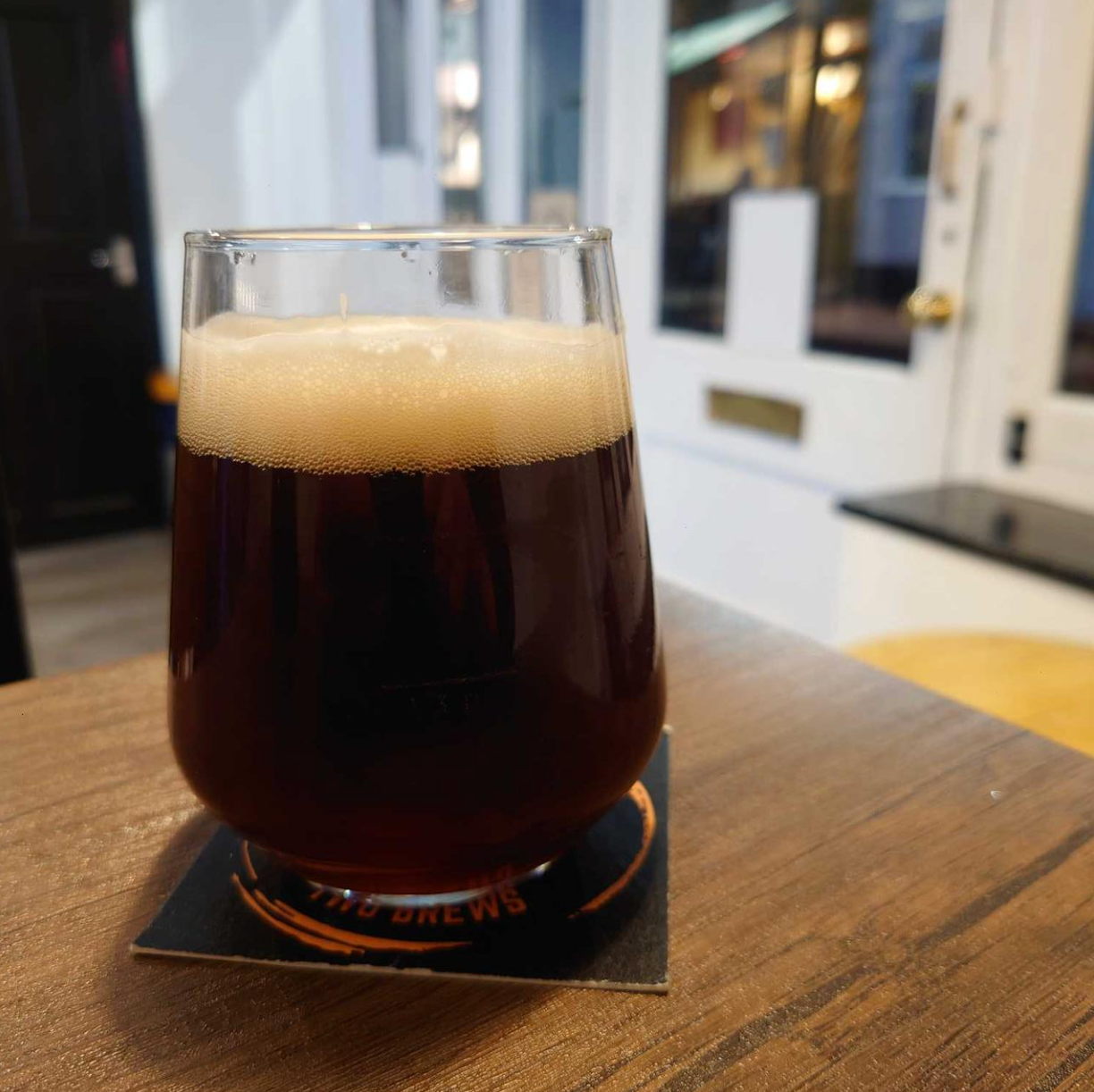 Amber-copper bitter poured into glass with off-white head and malty aroma