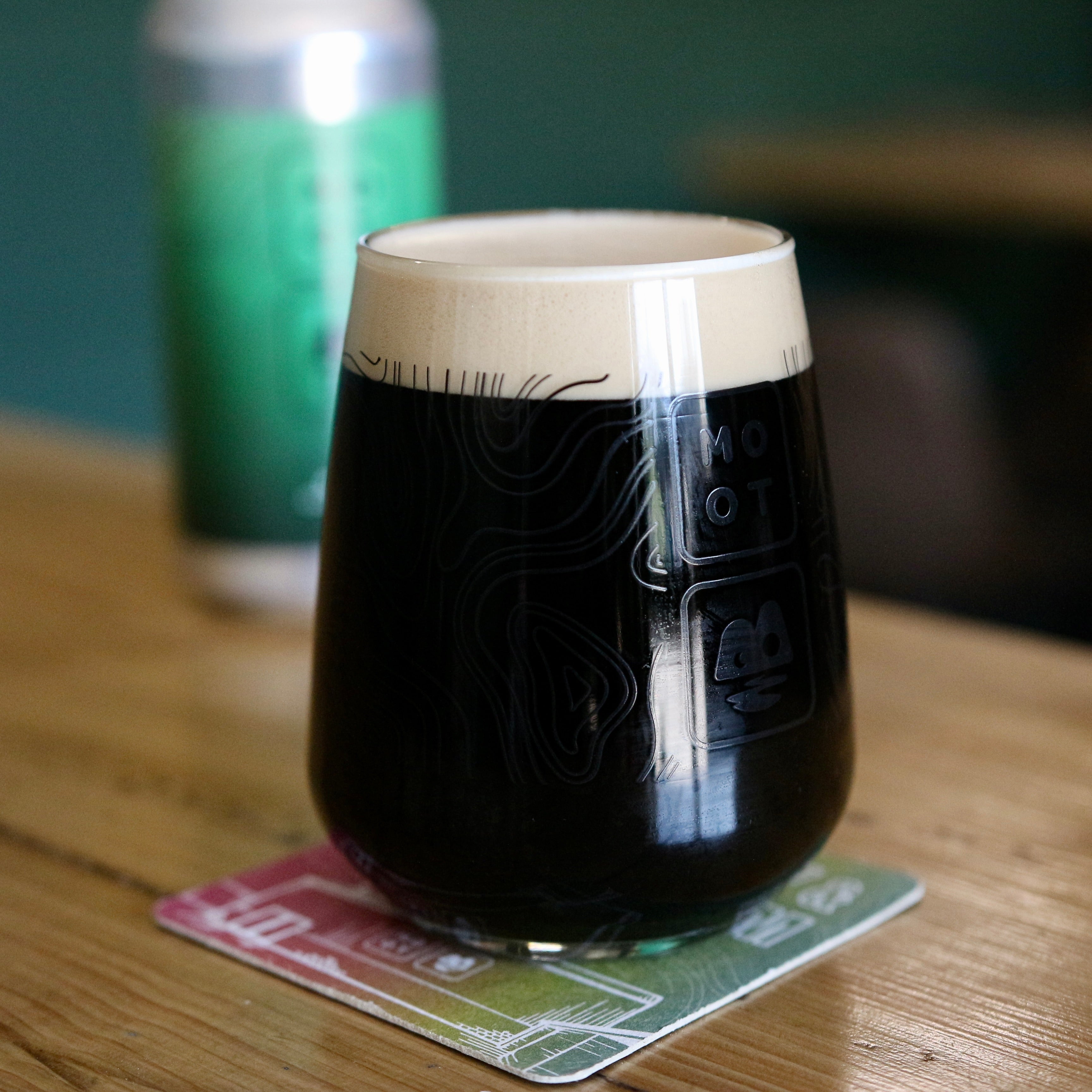 Dark stout poured into glass with tan foam head and roasted aroma